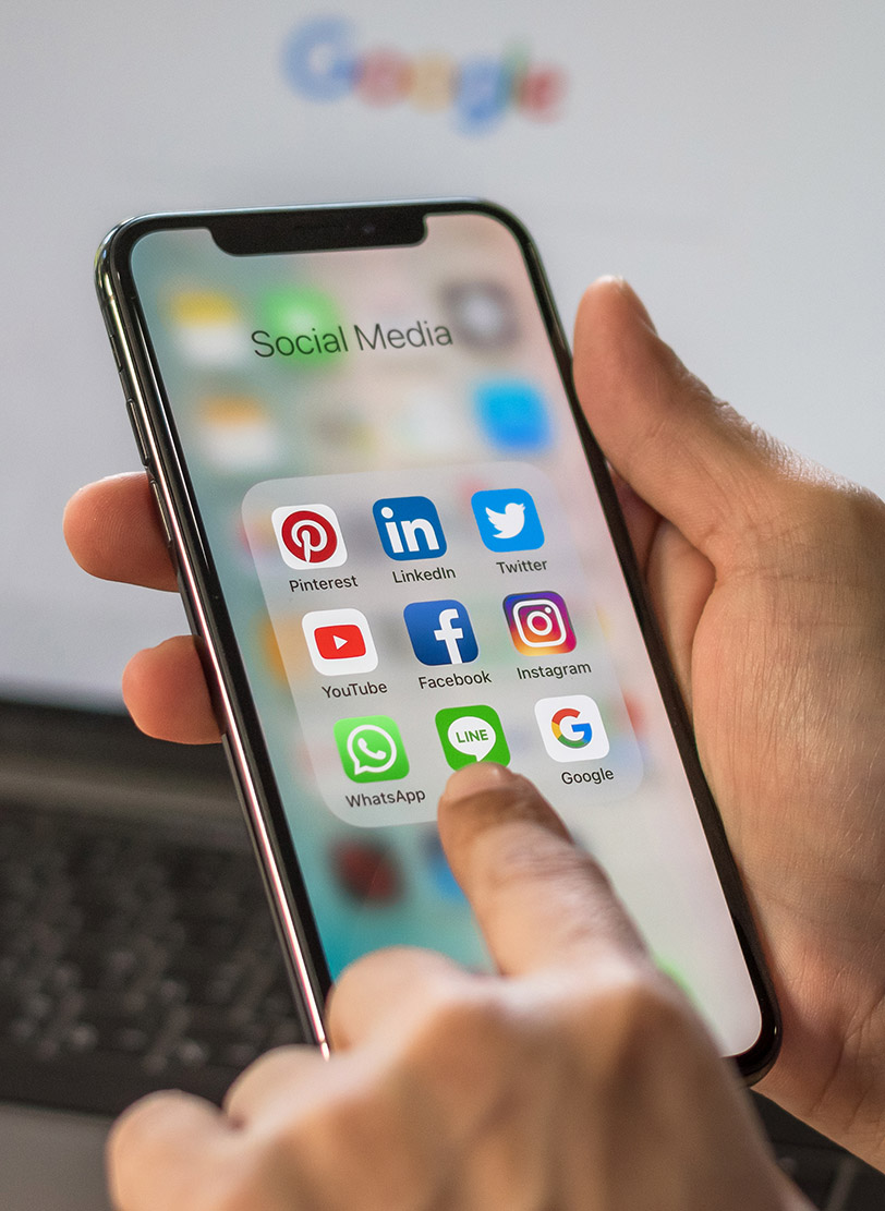 Phone screen open to a Social Media folder holding the Pinterest, LinkedIn, Twitter, YouTube, Facebook, Instagram and WhatsApp apps